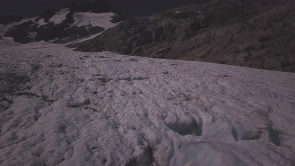 Low flight above mountain glacier