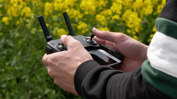 Drone control panel in the hands of a man.