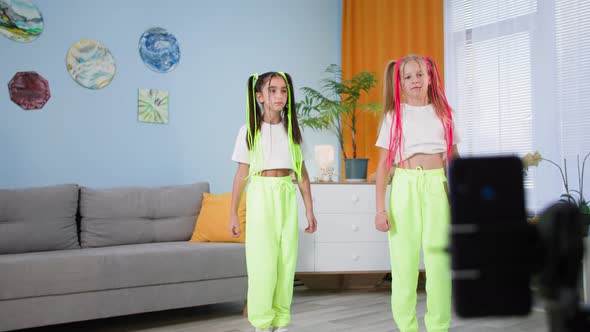 Children Bloggers Dance to Music at Home in Front of Mobile Phone Girlfriends Shoot Videos for