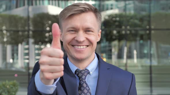 Thumbs Up By Successful Businessman