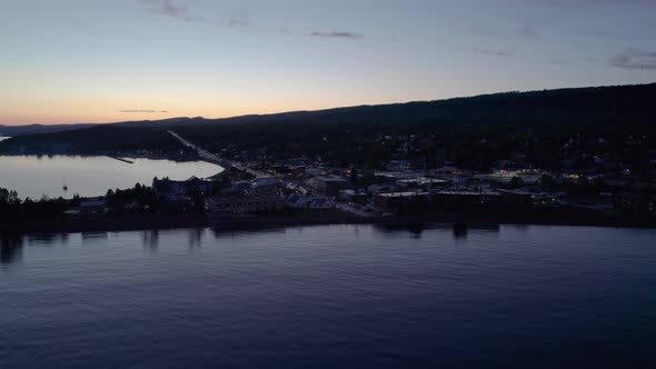 Late evening aerial drone shot of downtown Grand Marais, MN in the summer