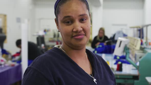 Front view of mixed race woman in factory