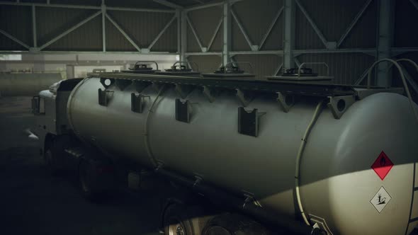 Large White Cistern Trucks in a Factory alt