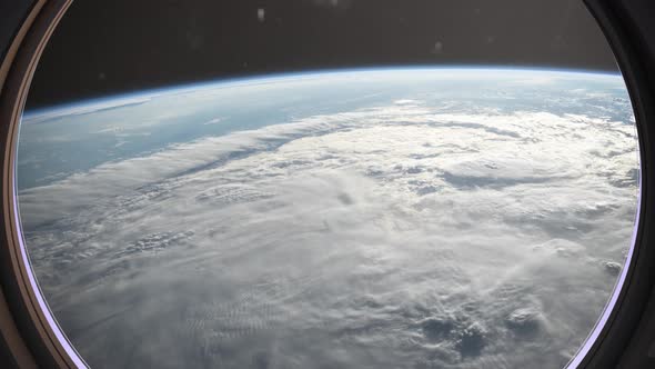 Earth As Seen Through Window Of Spaceship, Flight Of The Space Station Above The