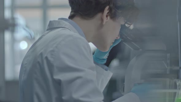 Female Scientists Observing Sample alt