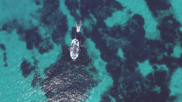 Boat sailing through transparent waters