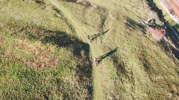 Aerial drone view of a mountain biker on a singletrack trail.