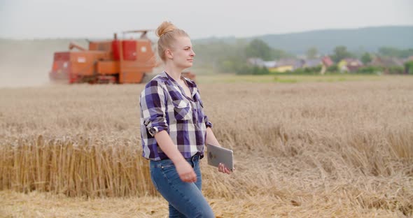 Agriculture Female Farmer Walking in Wheat Field with Digital Tablet