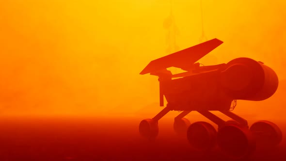 Planetary rover going through a desert on a Mars. Massive dust storm. Sandstorm.