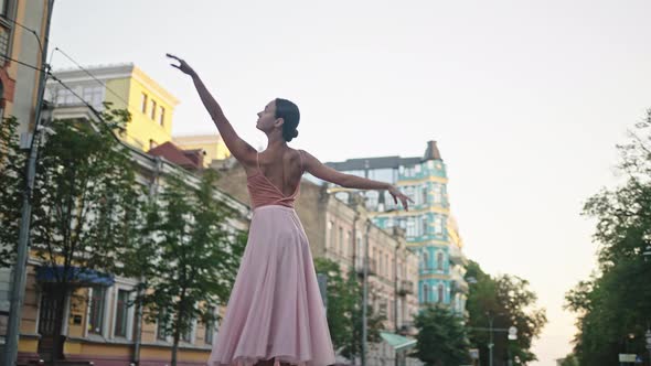 Graceful Dancer Shows Traditional Choreography at Sunrise