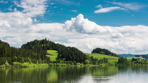 Green Hills at the Lake with Cloudscape