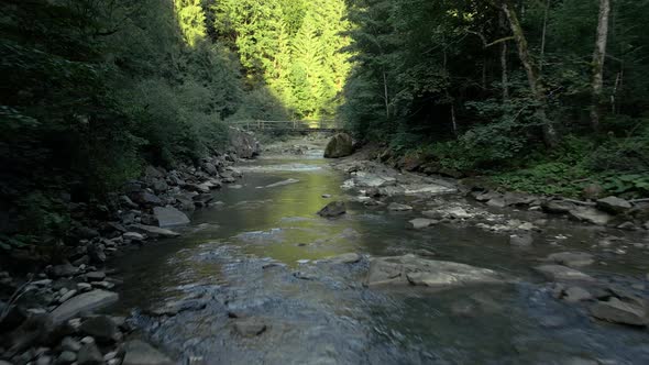 Moving Forward Above the River in Mountains