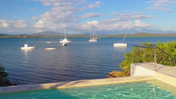 Fly over beach resort pool at Bahia de las Calderas, Dominican Republic. Aerial