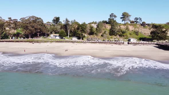 Small town and sandy exotic beach of Seacliff State, Santa Cruz, California, USA. Aerial view