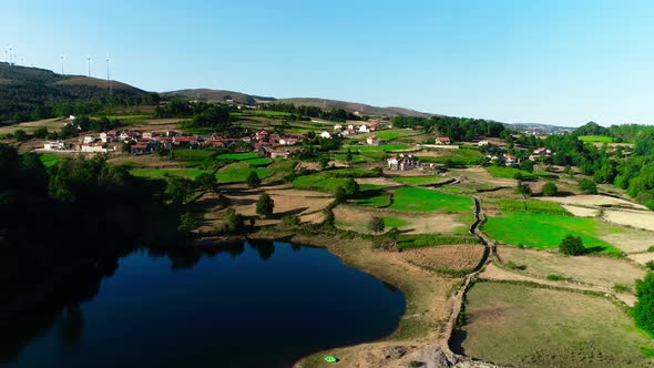 Aerial drone view of Portugal: buildings, agriculture, mountains and forest.