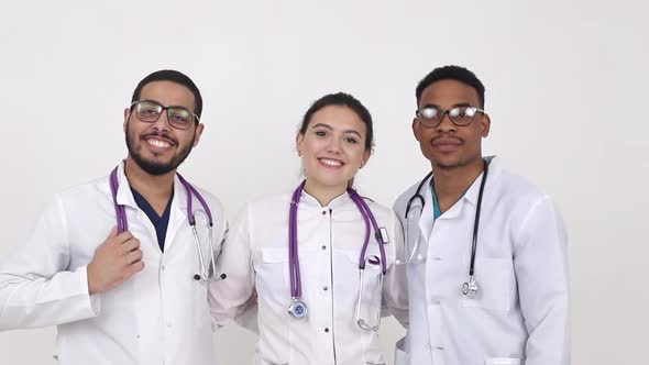 Medical students from different countries on a white background.