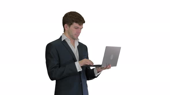 Businessman Using Laptop Computer Standing Great News on White Background.