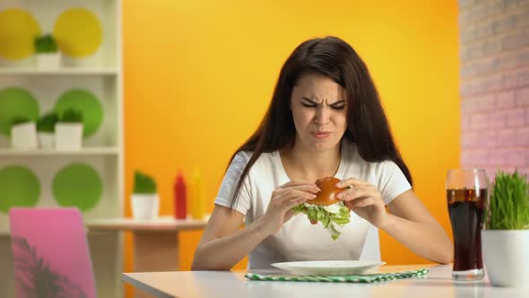 Pretty Lady Biting Stale Burger Drinking Soda Water, Unhappy Customer, Canteen