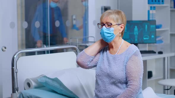 Retired Old Woman Wearing a Mask at Doctor