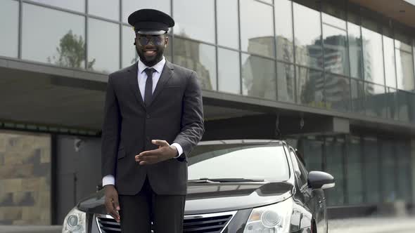 Luxury Taxi Service Driver Welcoming Very Important Client Near Expensive Car