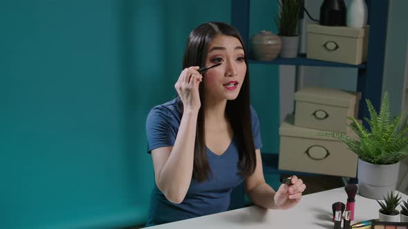 Asian Content Creator Testing Mascara Product on Vlogging Camera