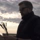 Farmer Works with a Computer Tablet in a Wheat Field at Sunset - VideoHive Item for Sale