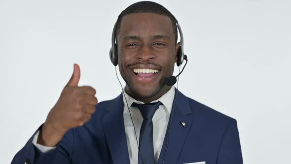 Thumbs Up By African Businessman with Headset White Background