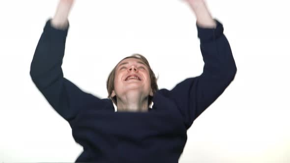 Portrait of Happy Teenage Boy in Braces Being Excited Expressing Delight Behaving Like Winner