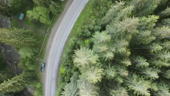 The Road in the Mountains. Slow Motion. Carpathians. Ukraine. Aerial. Gray, Flat