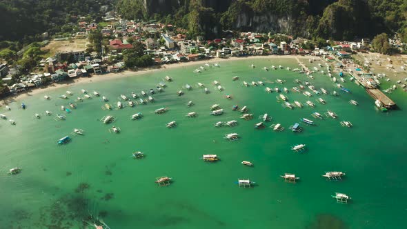 Tourist Boats in a Bay with Blue Water