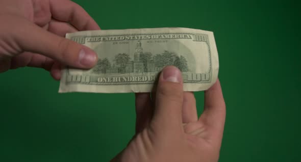 Dollars. American Money Close-up on a Green Background Hromakey . 100 Dollar Bills. One Hundred