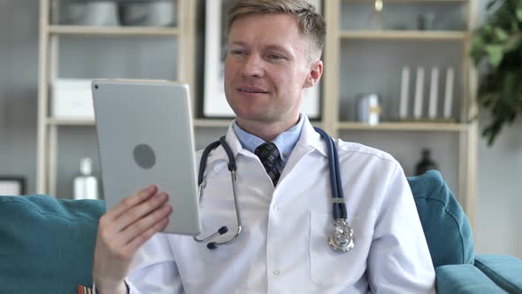 Doctor Sharing Good News on Video Chat on Tablet