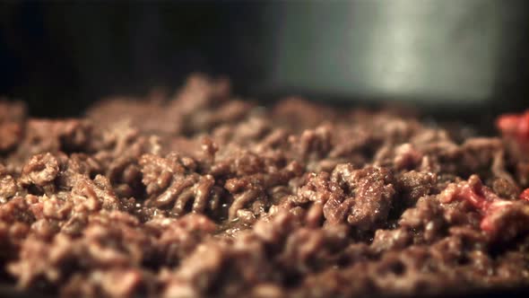 Super Slow Motion Minced Meat is Fried with Hot Steam and Spray Oil