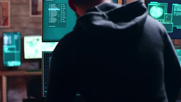 Male Hacker Typing on Keyboard a Dangerous Malware