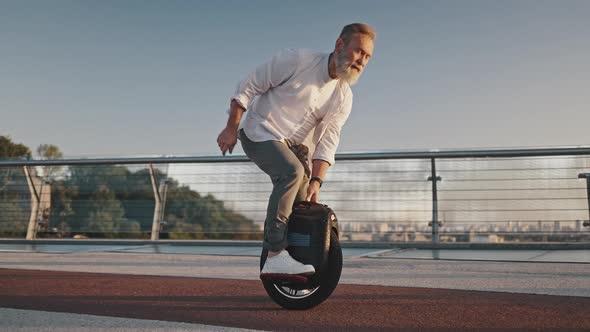 Active Bearded Pensioner Learns to Ride Electric Unicycle