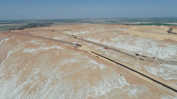 Mining of Potash Salt and Ore Salt Piles Aerial View of Industrial Quarries Conveyor Line in Salt