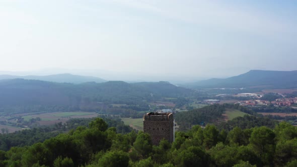 Aerial view over the ruins and painted forest of Torre Dels Soldats near Avinyo Barcelona.