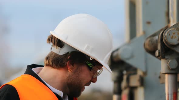 Portrait of smiling engineer wearing helmet