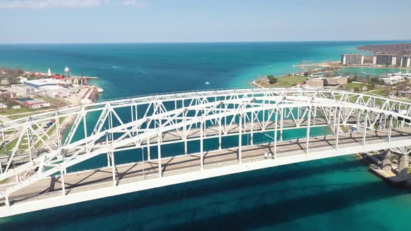 Blue Water Bridge connecting Port Huron, Michigan USA and Sarnia, Ontario Canada with droneing down.