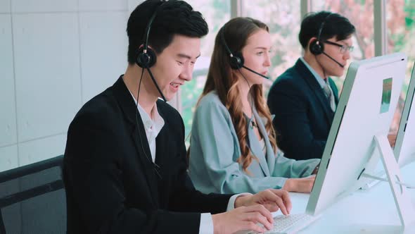 Business People Wearing Headset Working in Office