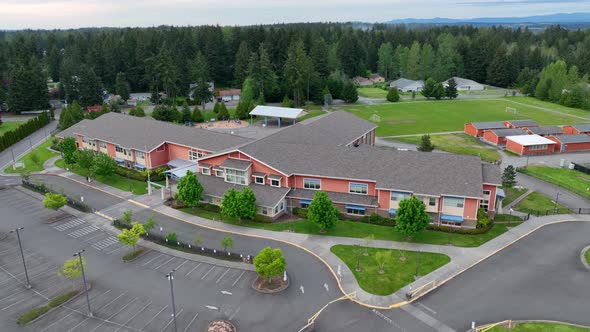 Drone shot of a public school building during the summer.