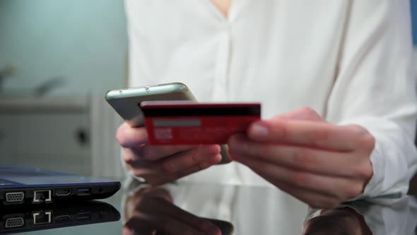 Woman Hold Credit Card and Use Smartphone
