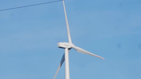 Windmill Farm Wind Electro Eco Energy Turbines on Blue Sky Background on European Pyrenees Mountains