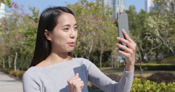 Woman having video call on cellphone