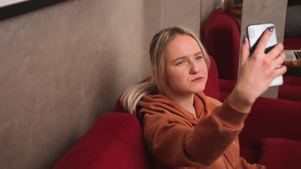 Relaxed Woman Making a Video Call Talking with Her Friend and Family at Home