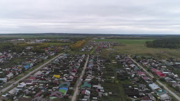 Early autumn in a rural village, aerial view 07