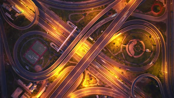 4K : Time lapse Aerial view and top view of traffic on city. Expressway with car lots