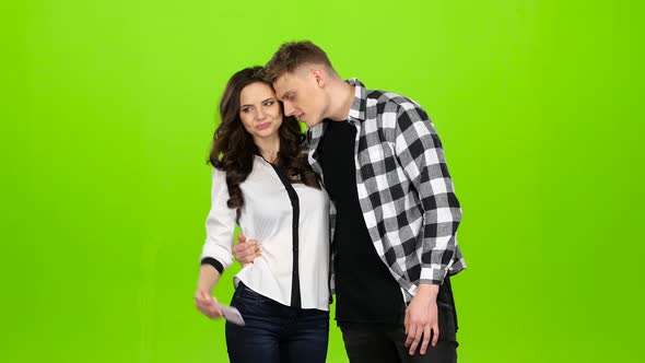 Loving Couple Flirts To Each Other and Makes Selfies. Green Screen