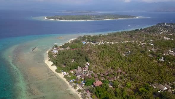 Very high three islands viewed from above. Gili Trawangan, Air, Meno.Tranquil aerial view flight pa