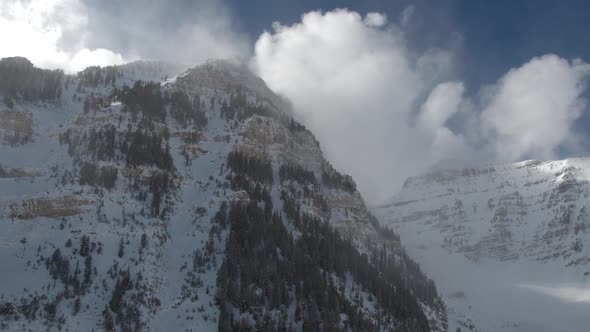 Panning view of snow covered mountains and cliffs